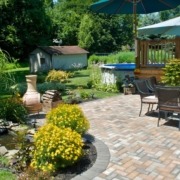 paver patio with lush landscaping - Spade Landscaping patio design