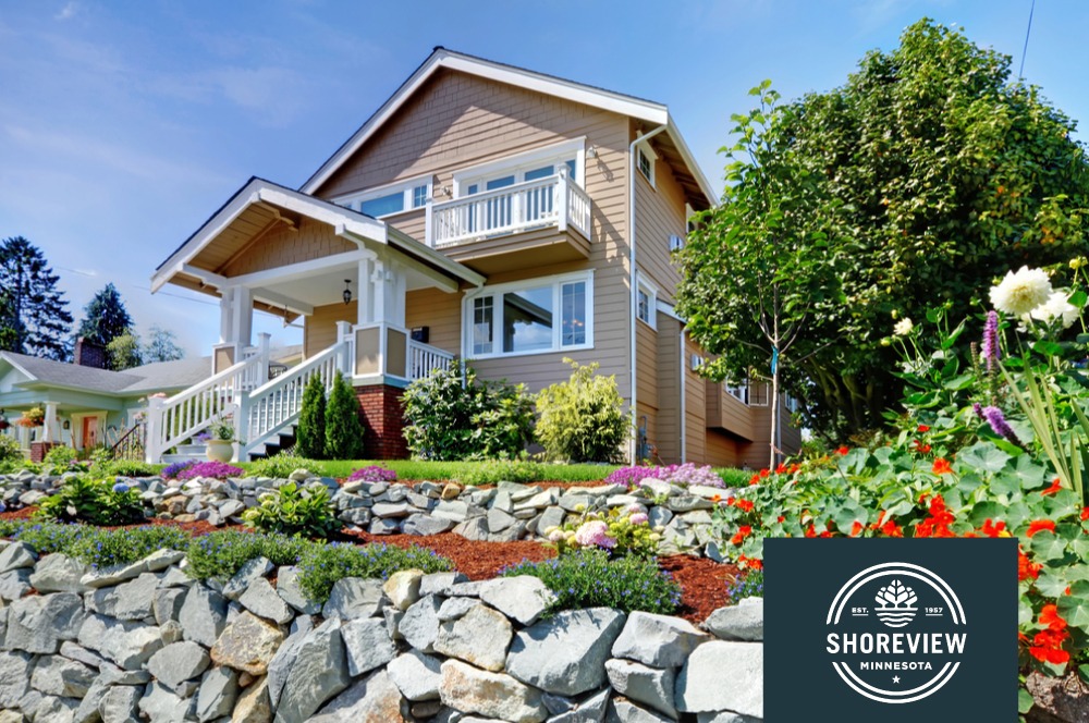 exterior of a suburban home with green grass - Spade Landscaping Landscaping Shoreview MN