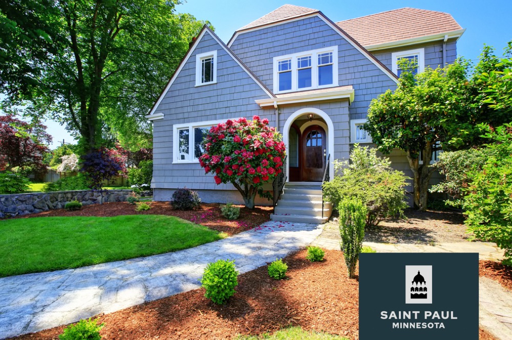 exterior of a suburban home with green grass and brown mulch - Spade Landscaping Landscaping St. Paul MN