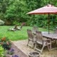 backyard with a patio and green grass - Spade Landscaping Lawn Care Services Near Hugo MN